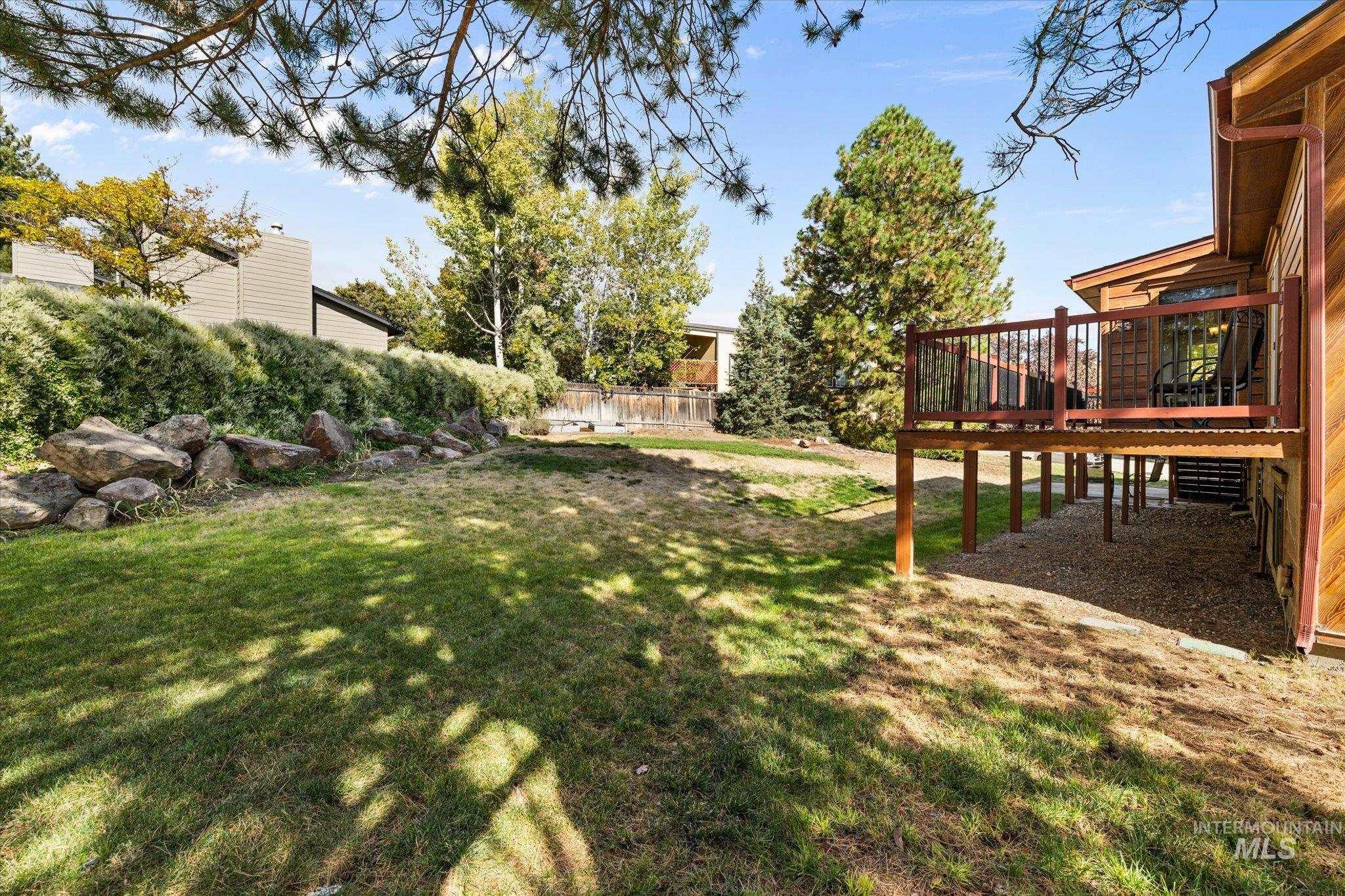 2199 South Ridge Point Way Boise, ID 83712 - Photo 42 of 50 View of yard with a deck