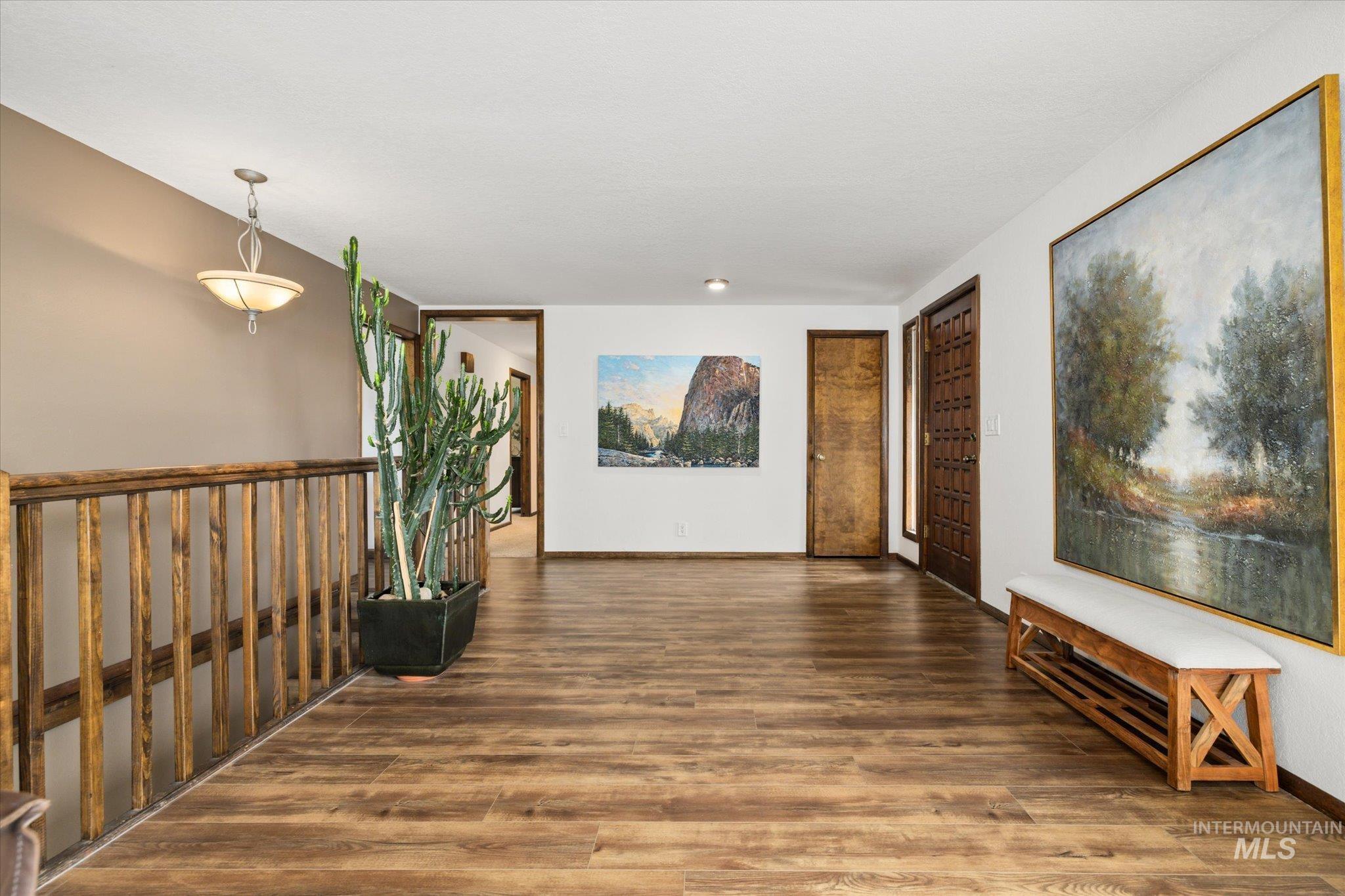 2199 South Ridge Point Way Boise, ID 83712 - Photo 5 of 50 Corridor with dark wood-type flooring and baseboards