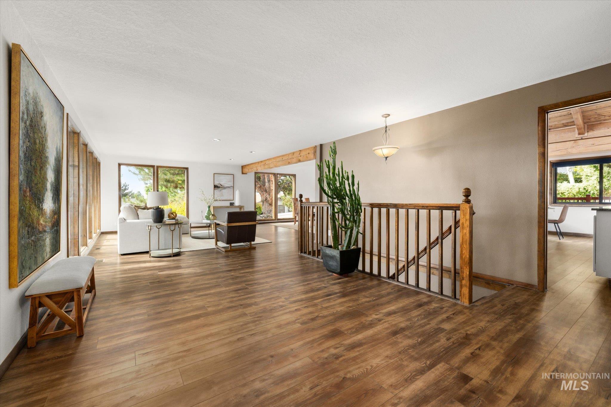 2199 South Ridge Point Way Boise, ID 83712 - Photo 6 of 50 Hallway with an upstairs landing and wood finished floors