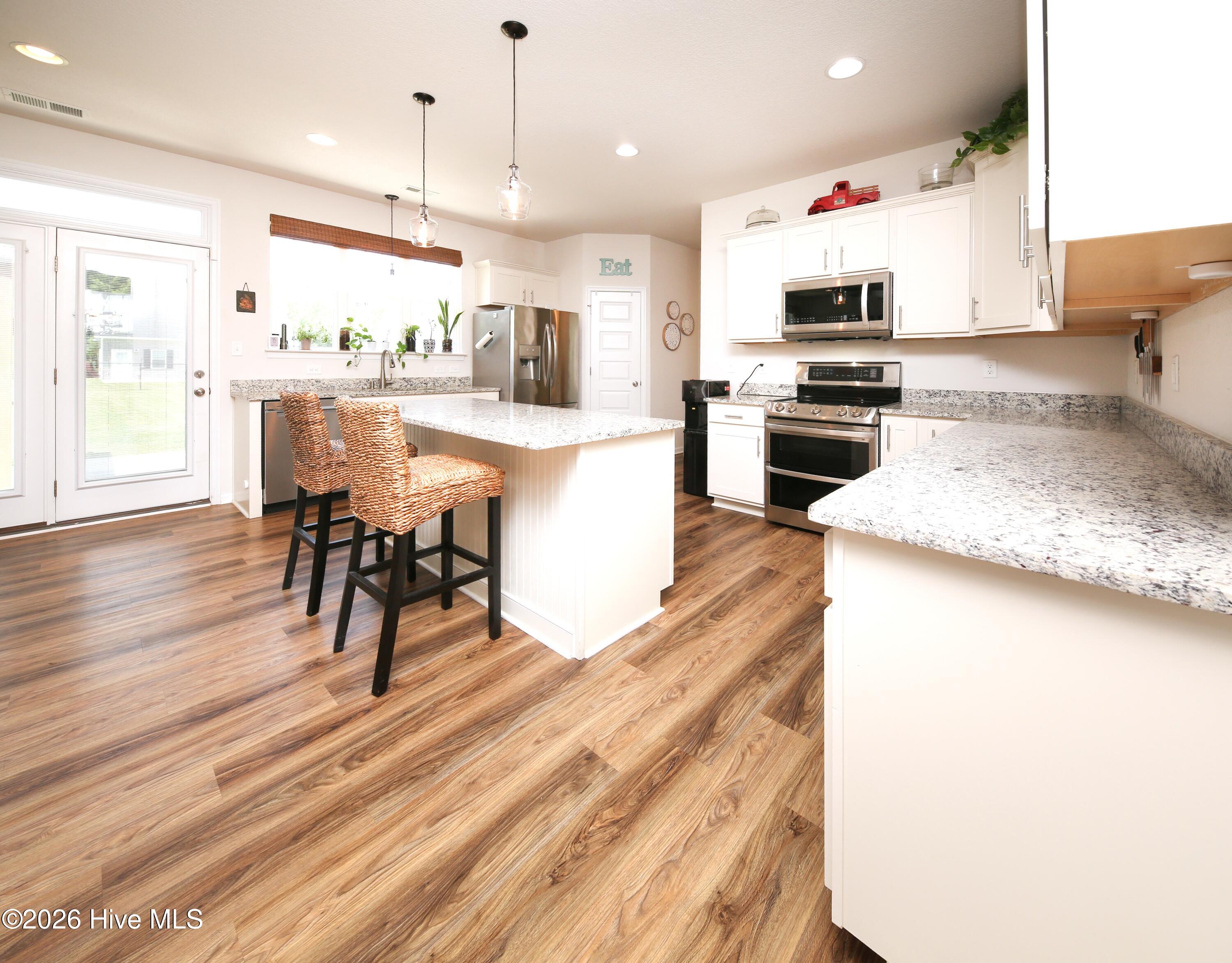 270 Keeter Barn Road South Mills, NC 27976 - Photo 11 of 45 KITCHEN W/ ISLAND, GRANITE COUNTERS AND SS APPLIANCES