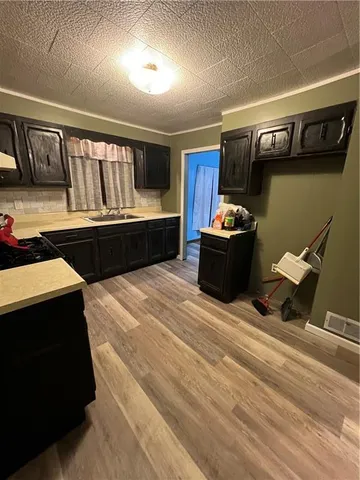 a kitchen with a stove and a refrigerator