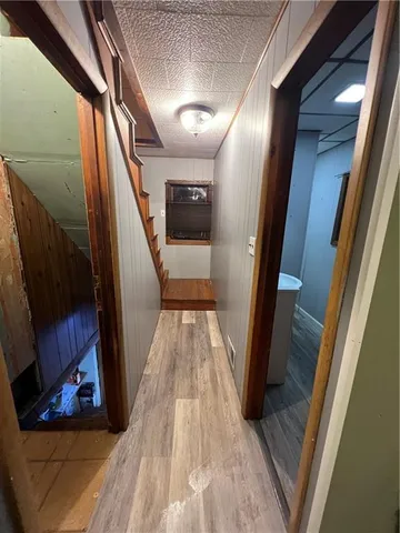 a view of entryway with stairs and wooden floor
