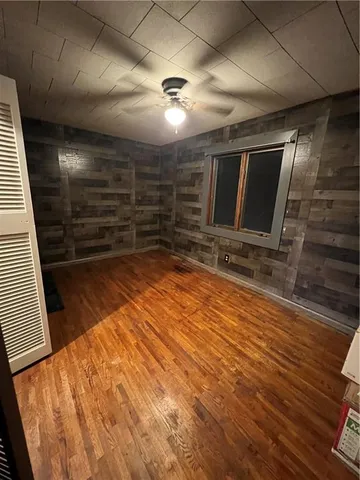 a view of room with wooden floor