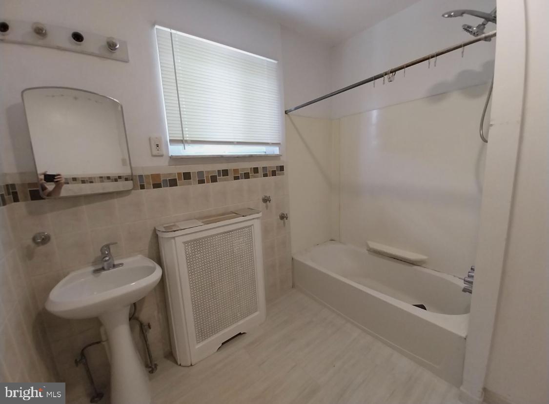 819 Kimball Street Philadelphia, PA 19147 - Photo 11 of 19 a bathroom with a sink toilet and shower