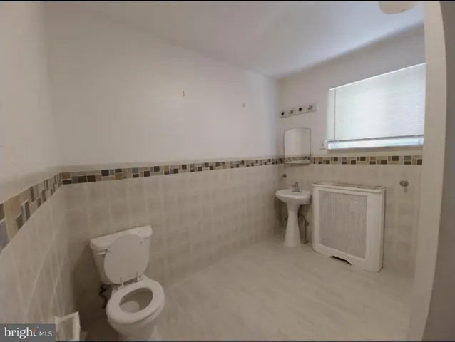 a bathroom with a toilet and a sink