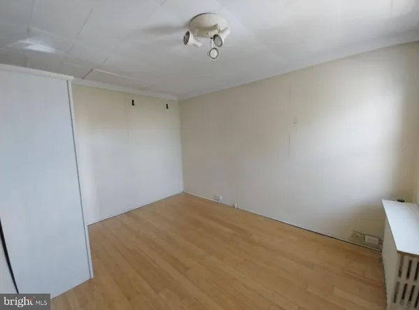 a view of small space with wooden floor