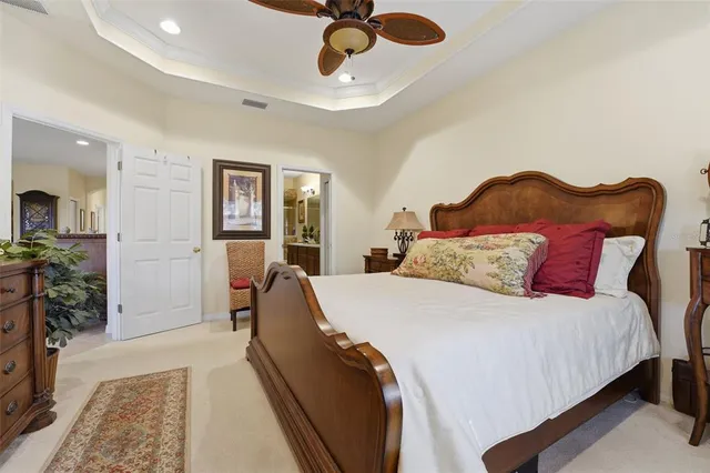 a spacious bedroom with a bed and furniture