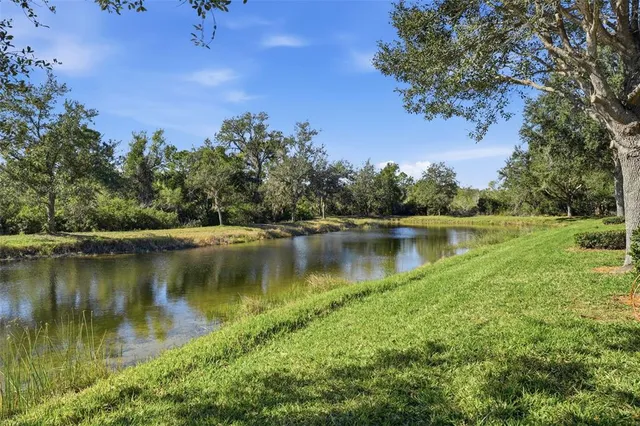 an aerial view of a house with swimming pool and garden