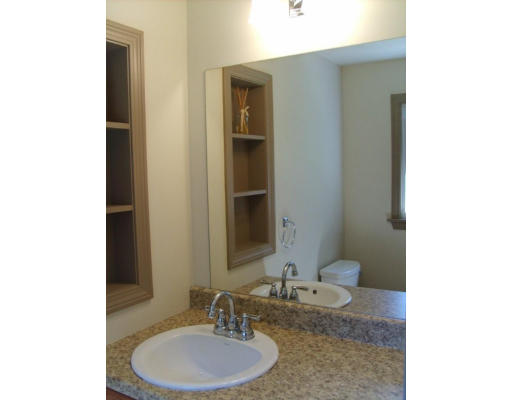 174 Armsby Road Sutton, MA 01590 - Photo 11 of 30 a bathroom with a granite countertop sink and a mirror
