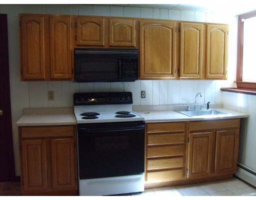 174 Armsby Road Sutton, MA 01590 - Photo 16 of 30 a kitchen with stainless steel appliances granite countertop wooden cabinets and a stove top oven
