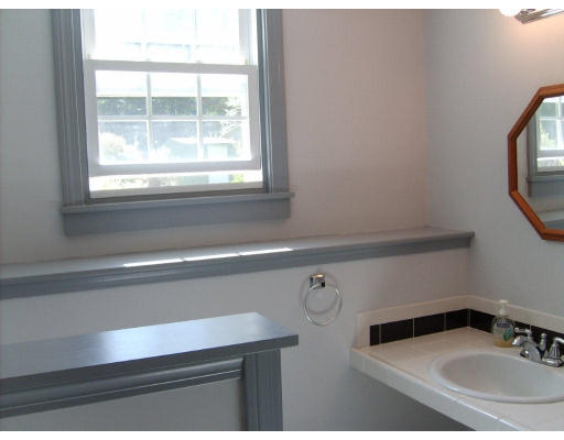 174 Armsby Road Sutton, MA 01590 - Photo 17 of 30 a bathroom with a sink and a window