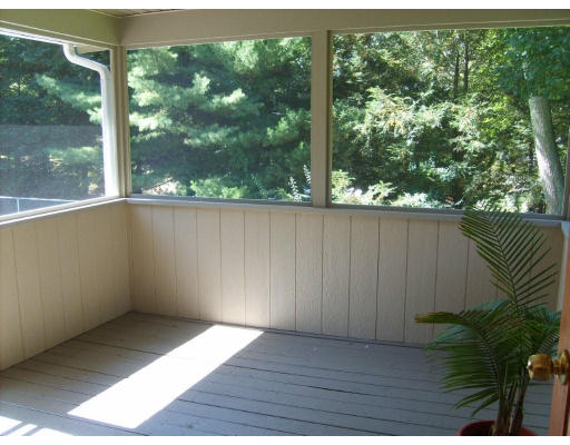 174 Armsby Road Sutton, MA 01590 - Photo 20 of 30 an empty room with wooden floor and windows