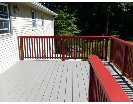 174 Armsby Road Sutton, MA 01590 - Photo 22 of 30 a balcony with wooden floor and outdoor space
