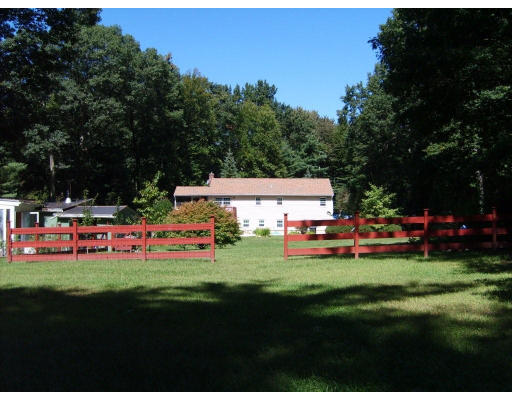174 Armsby Road Sutton, MA 01590 - Photo 30 of 30 a view of an house with backyard space and sitting area