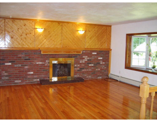174 Armsby Road Sutton, MA 01590 - Photo 4 of 30 a view of empty room with a fireplace