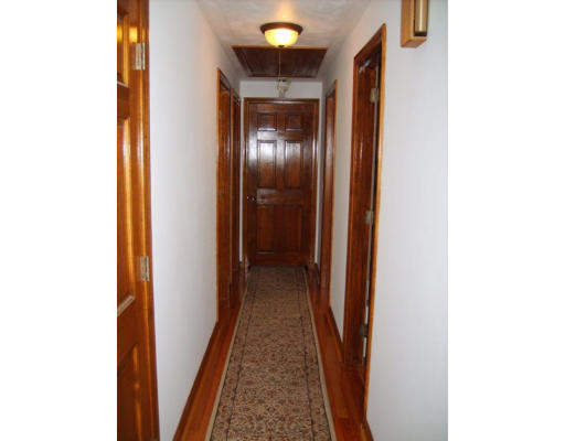 174 Armsby Road Sutton, MA 01590 - Photo 9 of 30 a view of a hallway with wooden floor