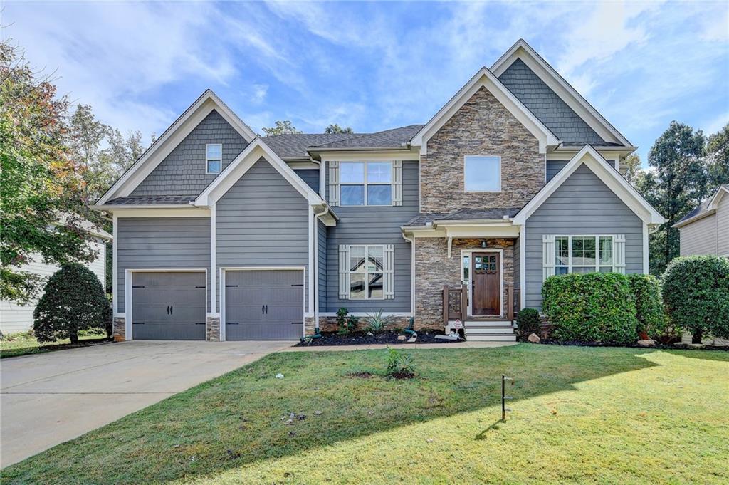 533 Widgeon Way Jefferson, GA 30549 - Photo 1 of 101 a front view of a house with a yard and garage