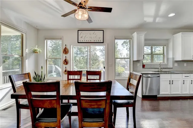 a bedroom with a large bed and a dresser