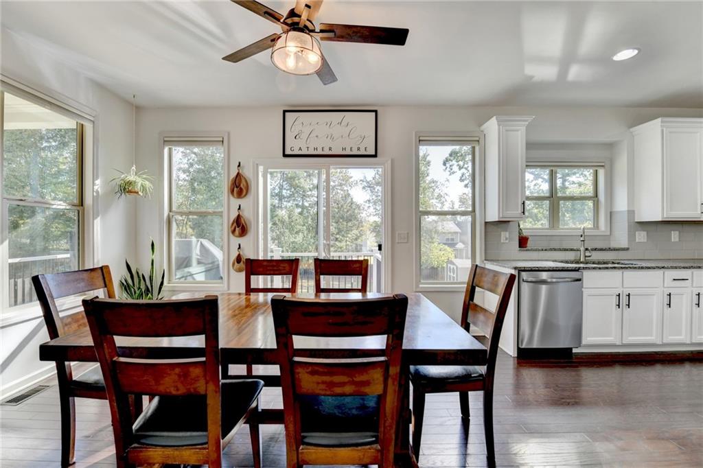 533 Widgeon Way Jefferson, GA 30549 - Photo 36 of 101 a view of a dining room with furniture window and wooden floor