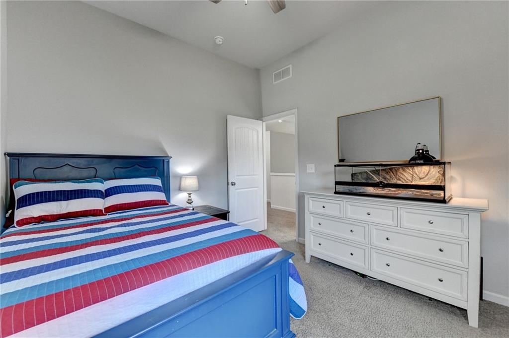 533 Widgeon Way Jefferson, GA 30549 - Photo 53 of 101 a bedroom with a bed and a dresser in it