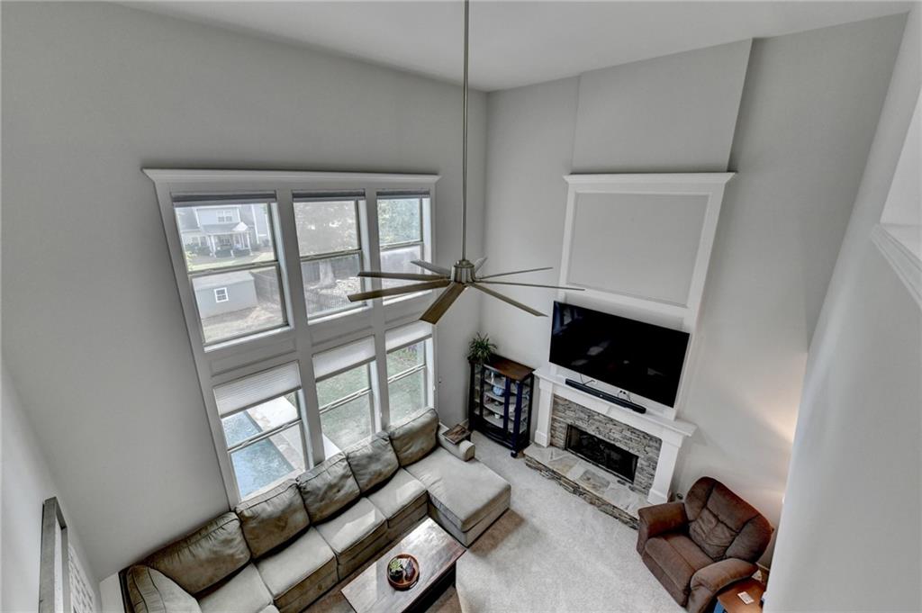 533 Widgeon Way Jefferson, GA 30549 - Photo 56 of 101 a living room with furniture a flat screen tv and a window