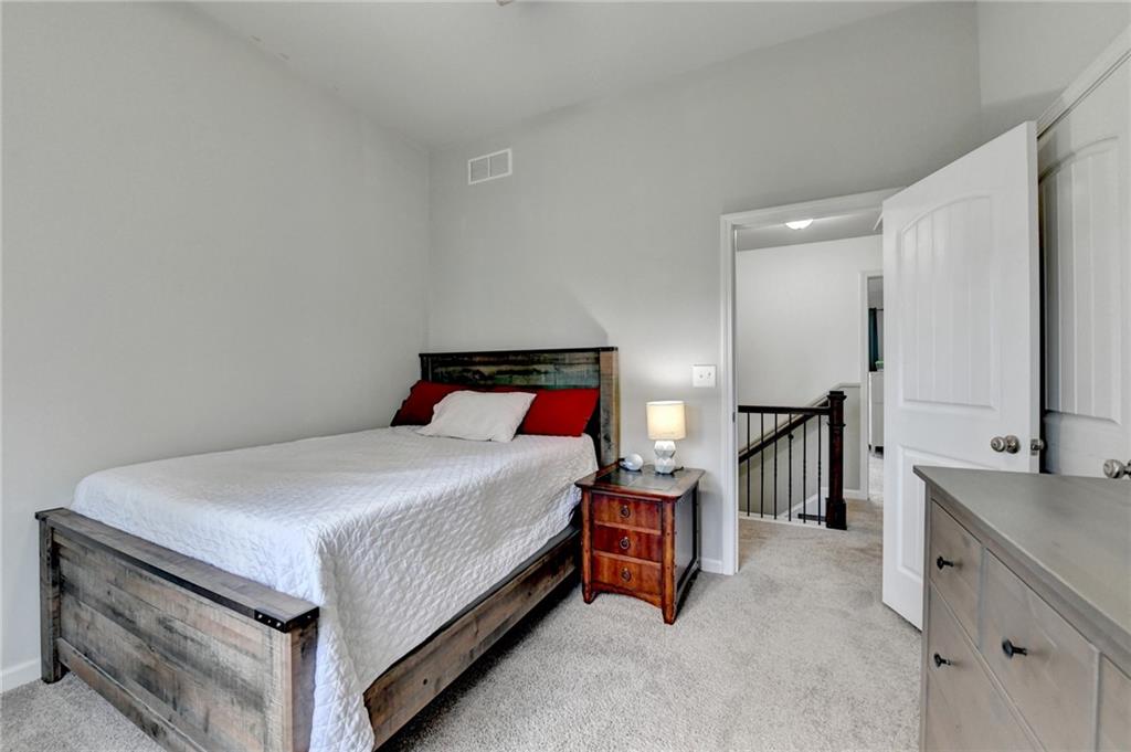 533 Widgeon Way Jefferson, GA 30549 - Photo 58 of 101 a bedroom with a bed and a dresser