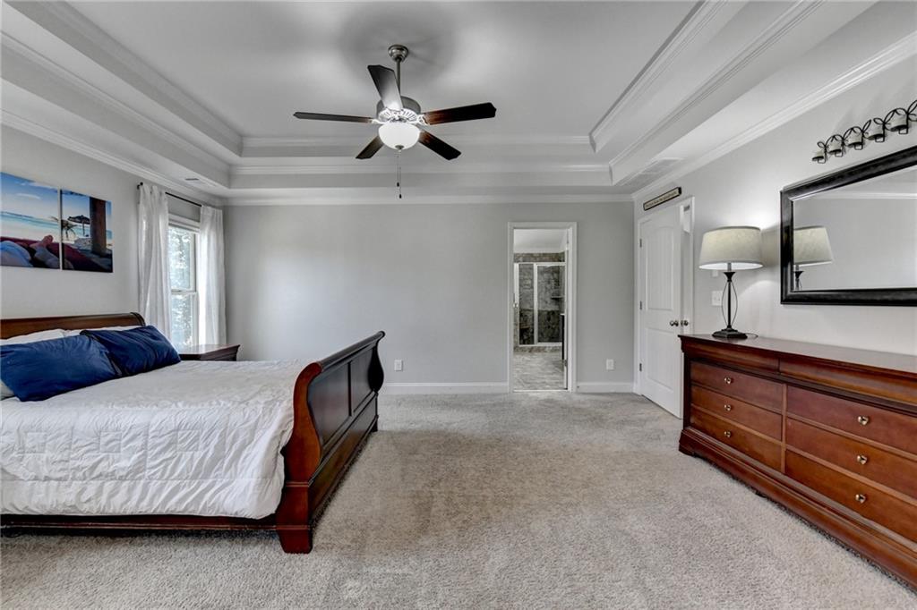 533 Widgeon Way Jefferson, GA 30549 - Photo 70 of 101 a bedroom with a bed and ceiling fan