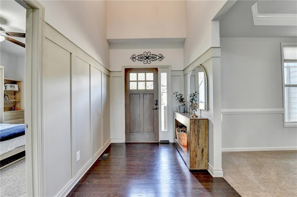 533 Widgeon Way Jefferson, GA 30549 - Photo 7 of 101 a view of a hallway with wooden floor and a window