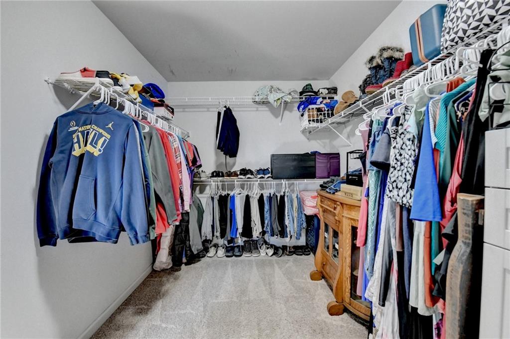533 Widgeon Way Jefferson, GA 30549 - Photo 79 of 101 a view of walk in closet with clothes