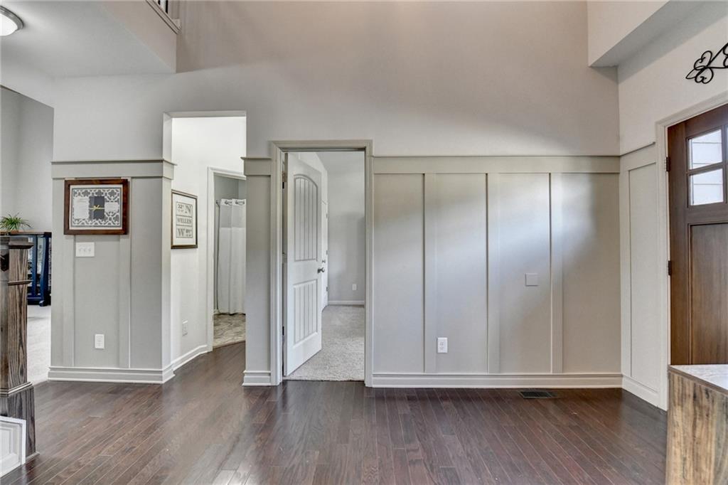 533 Widgeon Way Jefferson, GA 30549 - Photo 8 of 101 a view of an empty room with wooden floor and a window