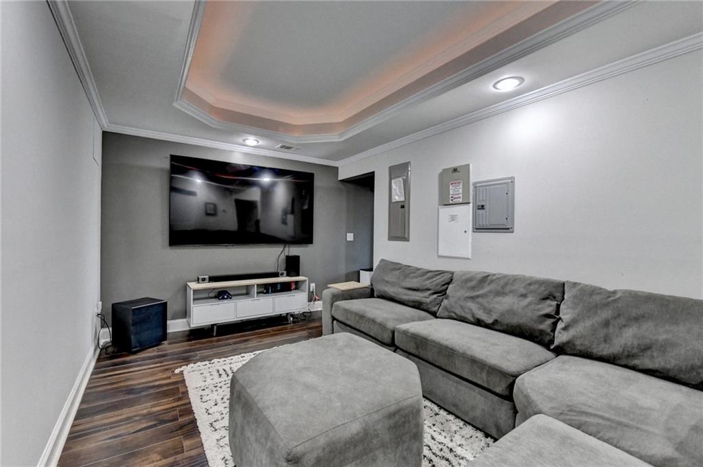 533 Widgeon Way Jefferson, GA 30549 - Photo 89 of 101 a living room with furniture and a flat screen tv