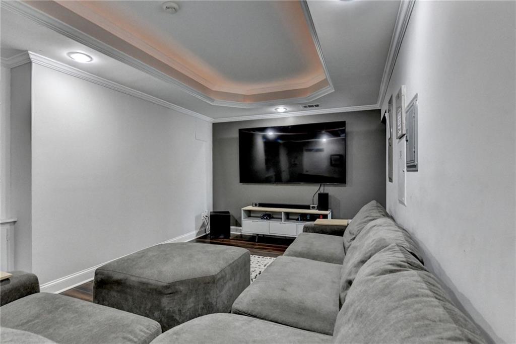 533 Widgeon Way Jefferson, GA 30549 - Photo 91 of 101 a living room with furniture and a flat screen tv