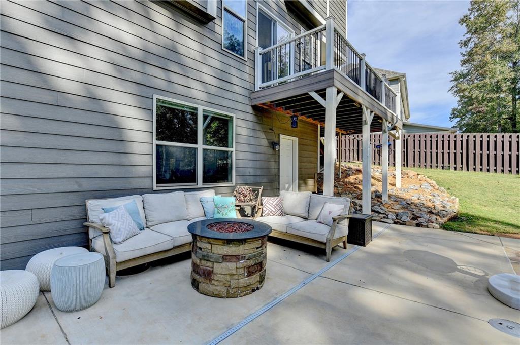 533 Widgeon Way Jefferson, GA 30549 - Photo 98 of 101 a view of a patio with couches table and chairs and potted plants