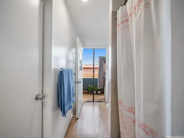 a view of a bathroom from a hallway