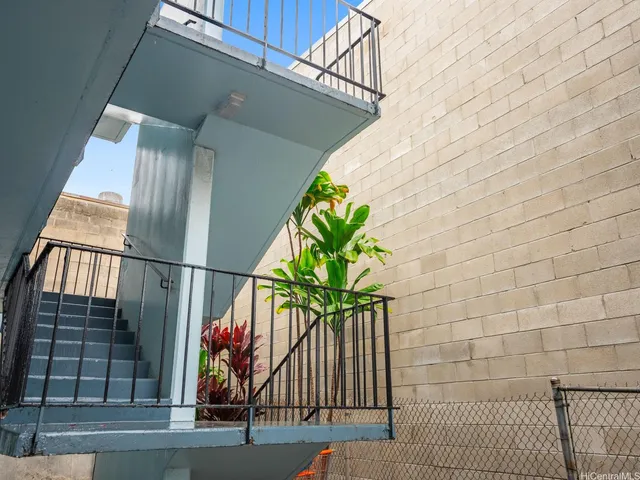 a vase of flowers sitting on a floor
