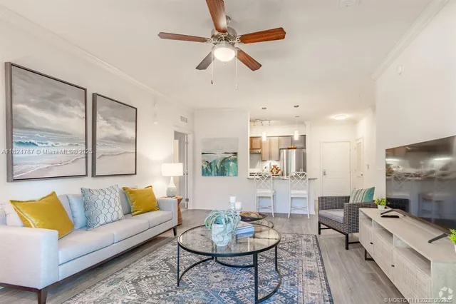 a living room with fireplace furniture and a chandelier