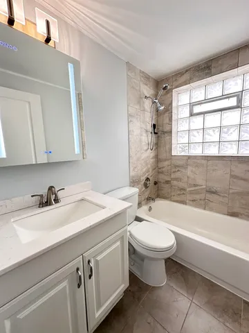 a bathroom with a sink toilet and bathtub
