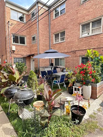 a view of a chairs and table in a patio