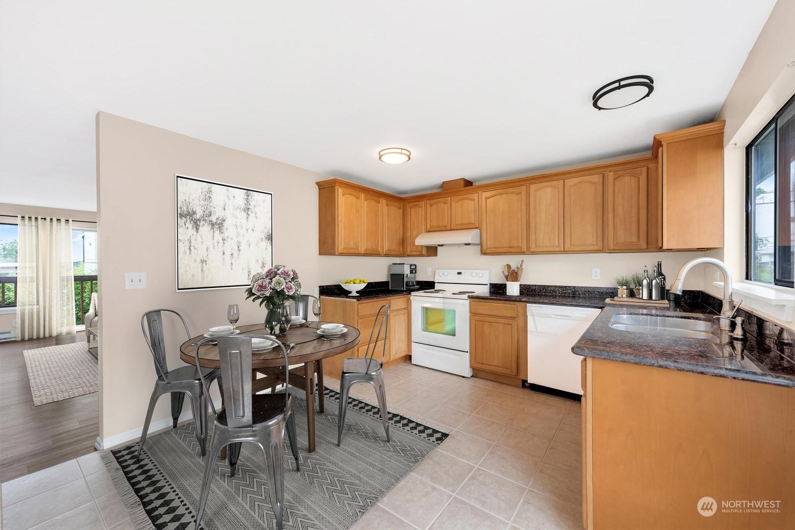 1715 16th Avenue South Seattle, WA 98144 - Photo 21 of 38 a kitchen with sink a window and chairs