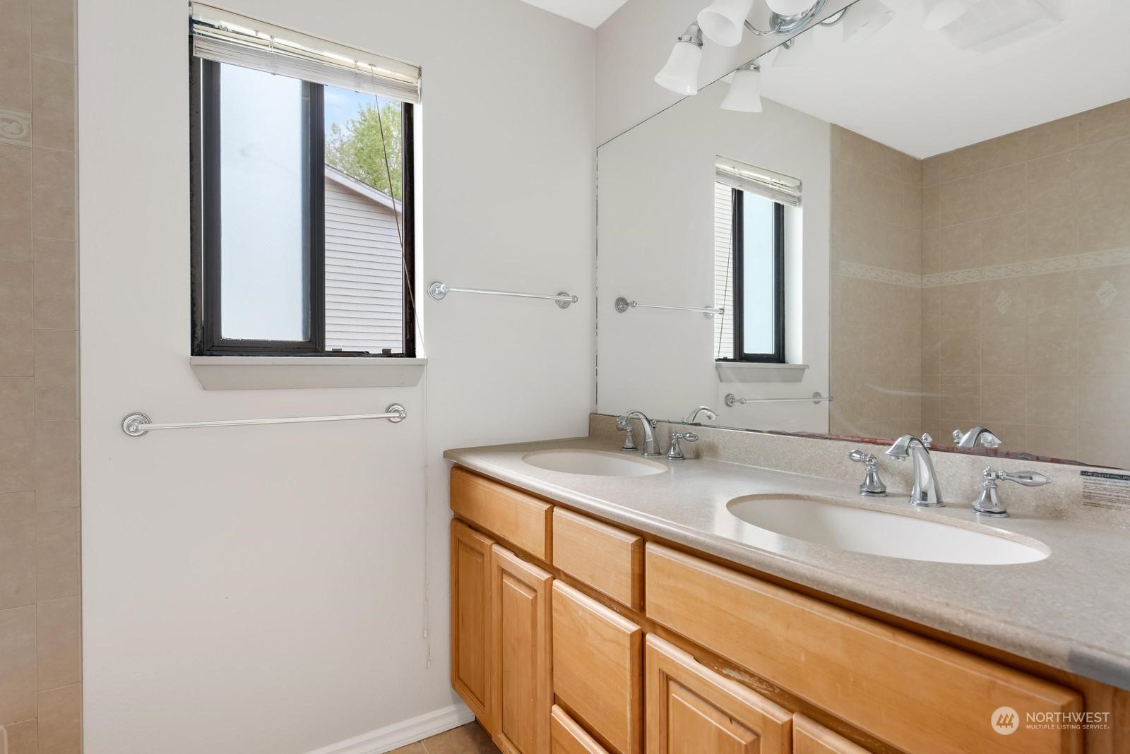 1715 16th Avenue South Seattle, WA 98144 - Photo 27 of 38 a bathroom with a sink and a mirror