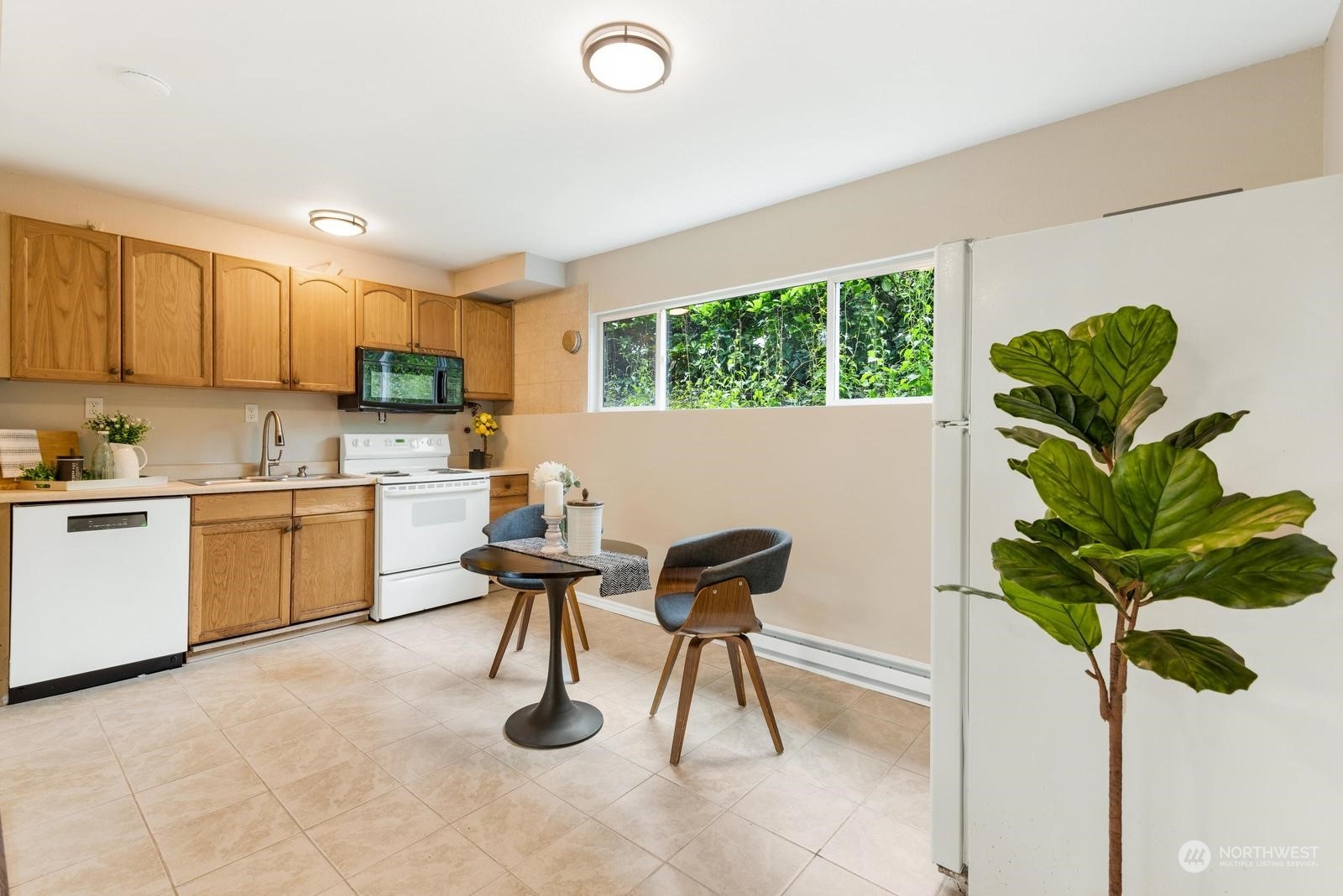 1715 16th Avenue South Seattle, WA 98144 - Photo 6 of 38 a view of a kitchen with furniture and a potted plant