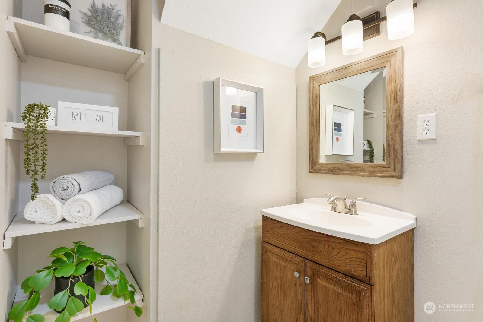 1715 16th Avenue South Seattle, WA 98144 - Photo 10 of 38 a bathroom with a sink mirror and vanity