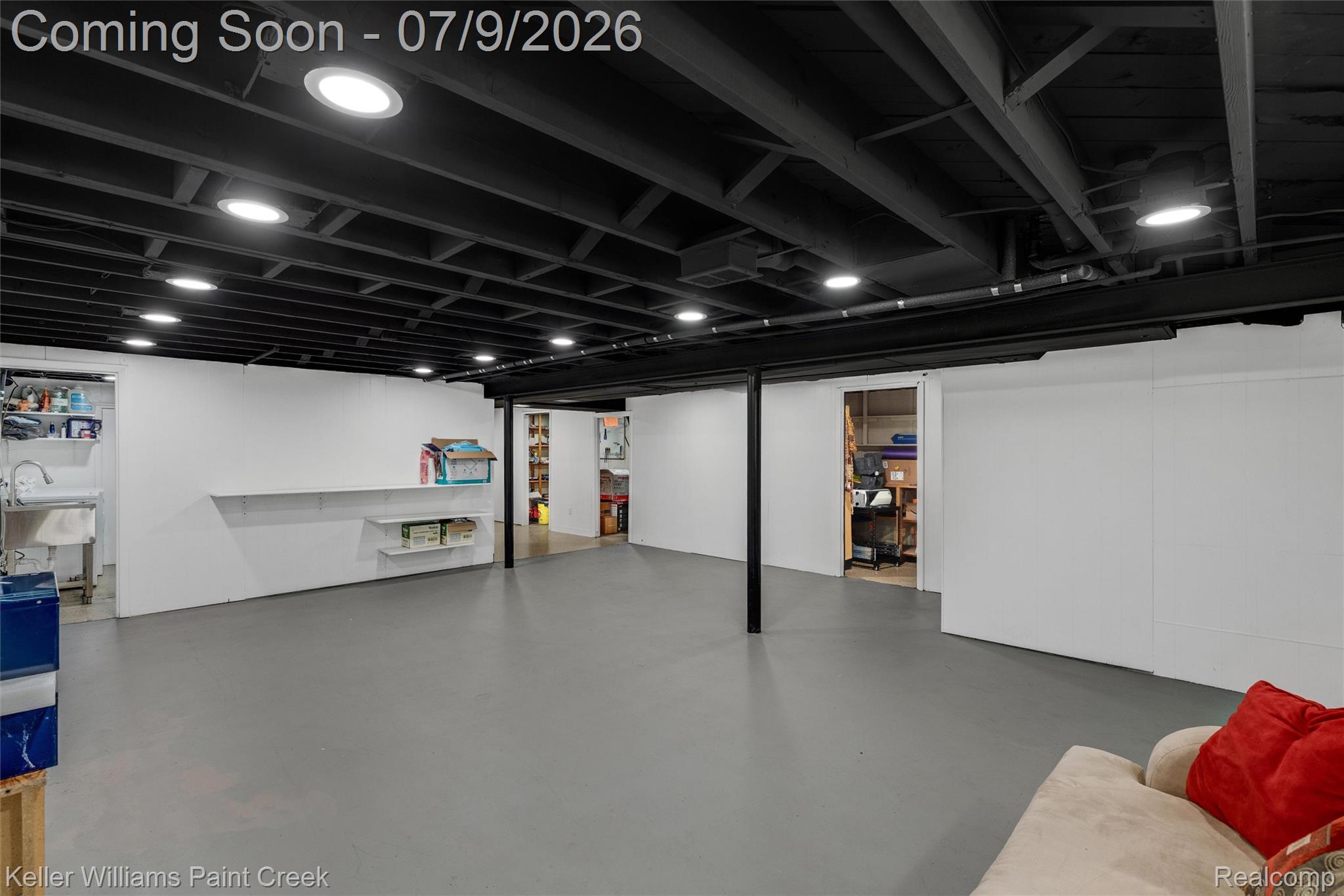 2731 Crooks Road Royal Oak, MI 48073 - Photo 22 of 34 Spacious finished basement featuring recessed lighting, a utility sink, painted exposed joists, and durable flooring