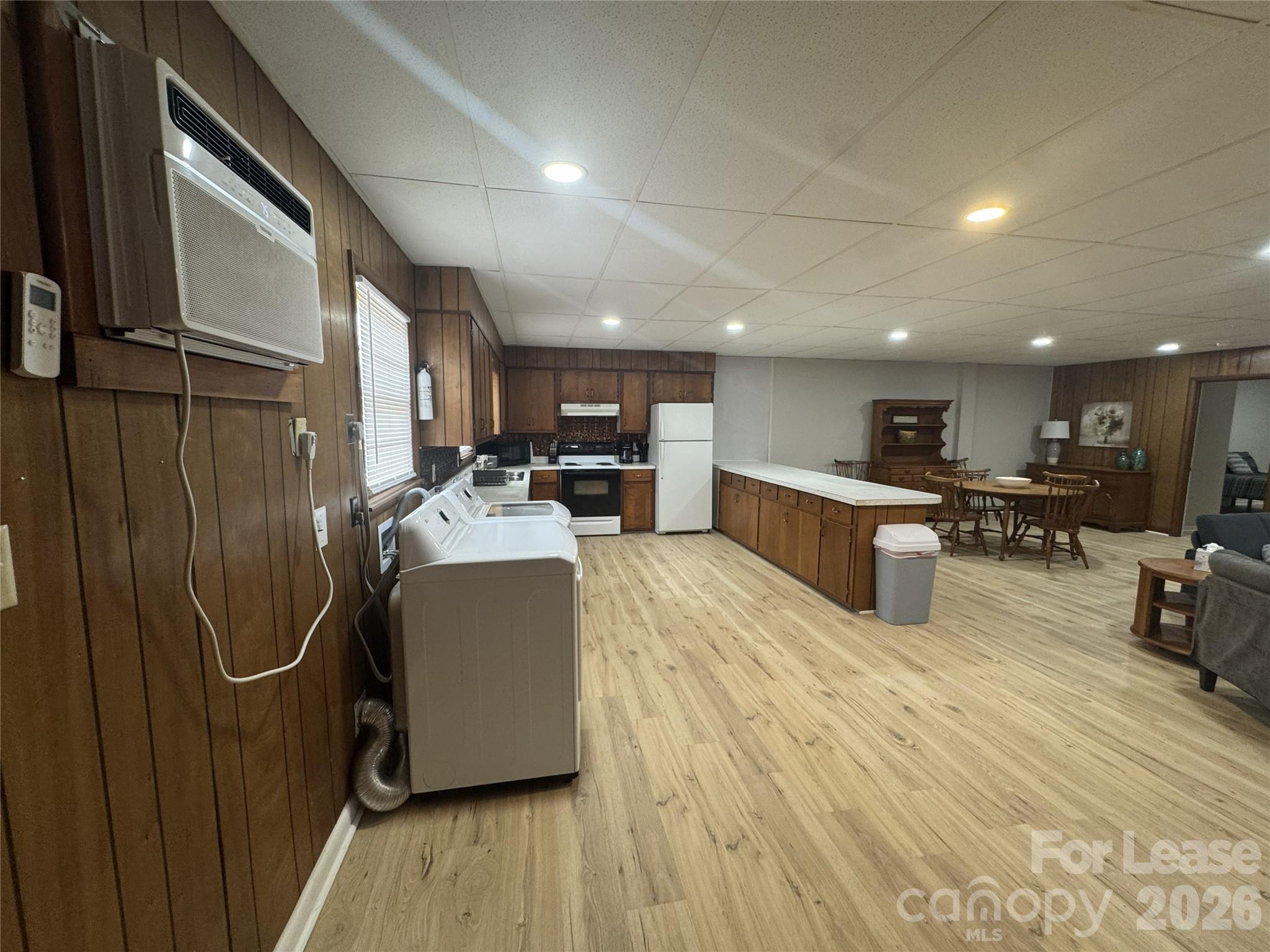 319 Connelly Springs Road, Unit A Lenoir, NC 28645 - Photo 5 of 10 a room with wooden floor and furniture