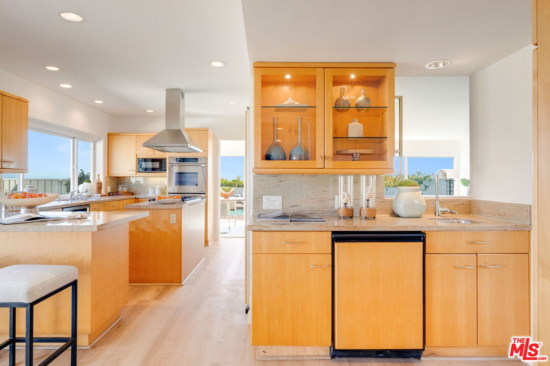 18332 Wakecrest Drive Malibu, CA 90265 - Photo 12 of 30 a kitchen with counter top space and a sink