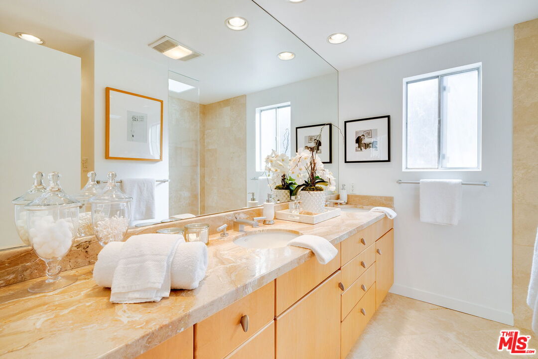 18332 Wakecrest Drive Malibu, CA 90265 - Photo 20 of 30 a bathroom with a double vanity sink mirror and