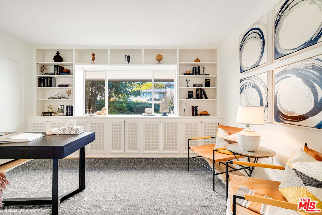 18332 Wakecrest Drive Malibu, CA 90265 - Photo 23 of 30 a living room with furniture a rug and white walls