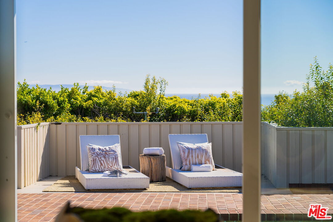 18332 Wakecrest Drive Malibu, CA 90265 - Photo 4 of 30 a view of a couches in patio with a yard