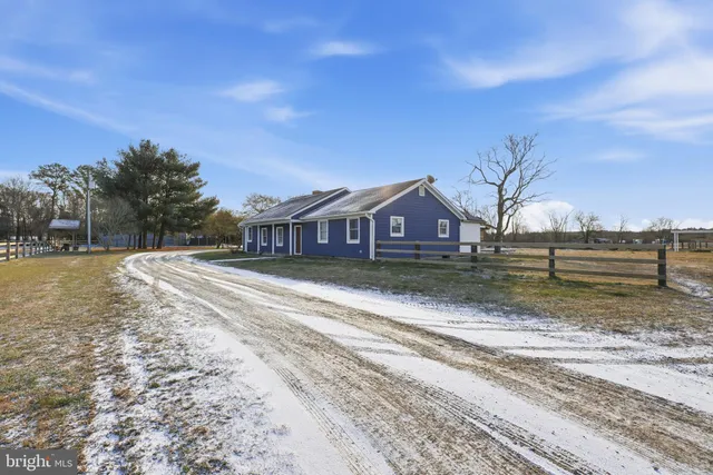 a front view of a house with a big yard