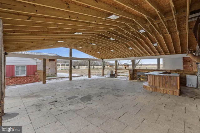 an aerial view of a house with a yard and lake view